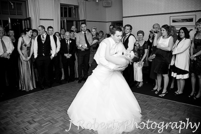 Bride being dipped by the groom during bridal waltz at The Tea Room Gunners' Barracks - wedding photography sydney